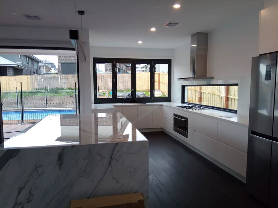 Modern kitchen with large windows.