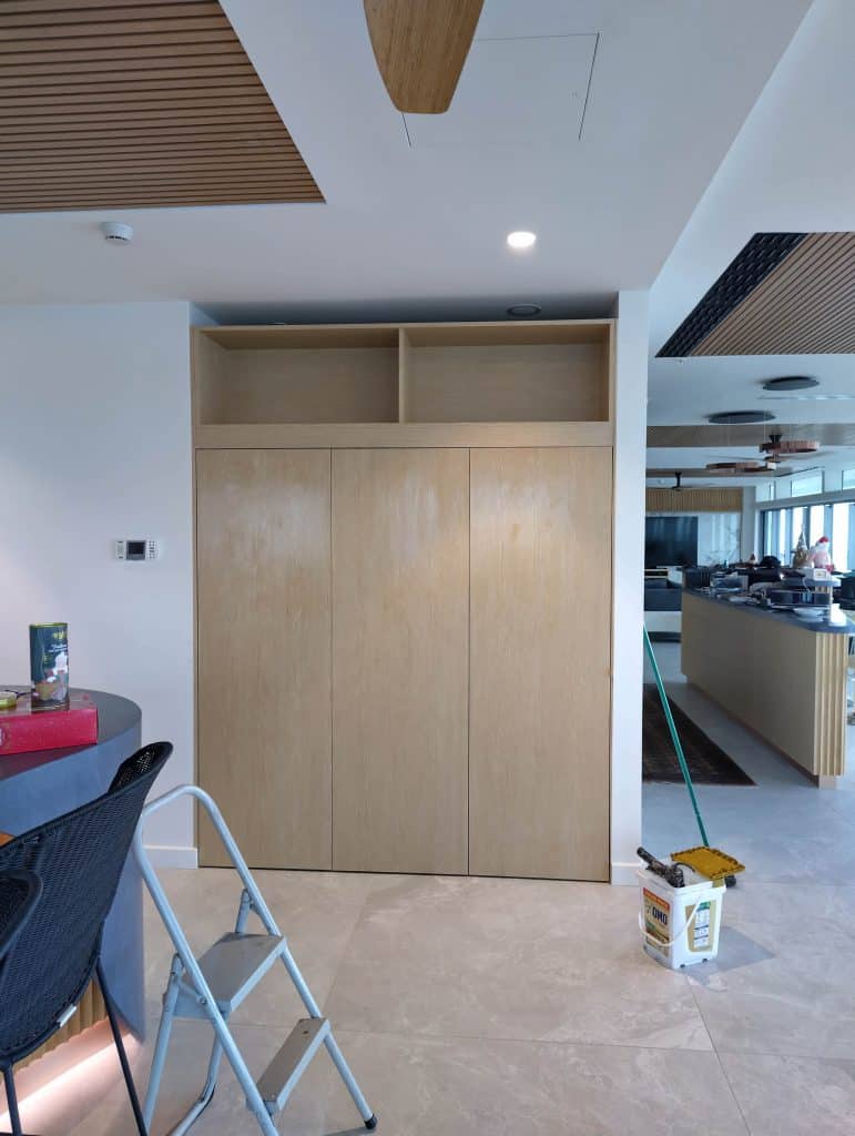 Minimalist kitchen with wooden cabinetry.